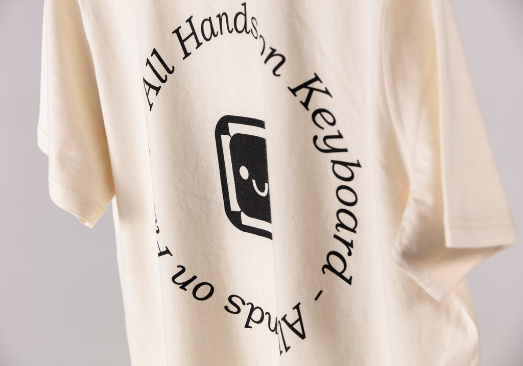 The Signature Tee. Natural. All Hands On Keyboard - All Hands on Planet Black