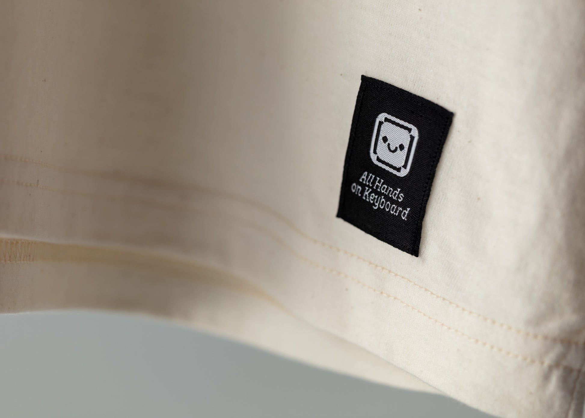 The Signature Tee. Natural. All Hands On Keyboard - All Hands on Planet Black