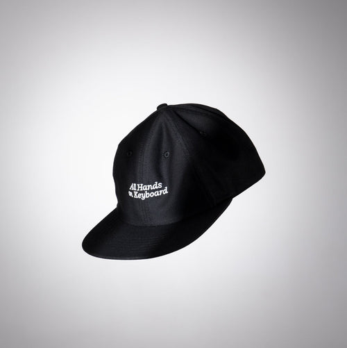 Black cap with white text on a gray background